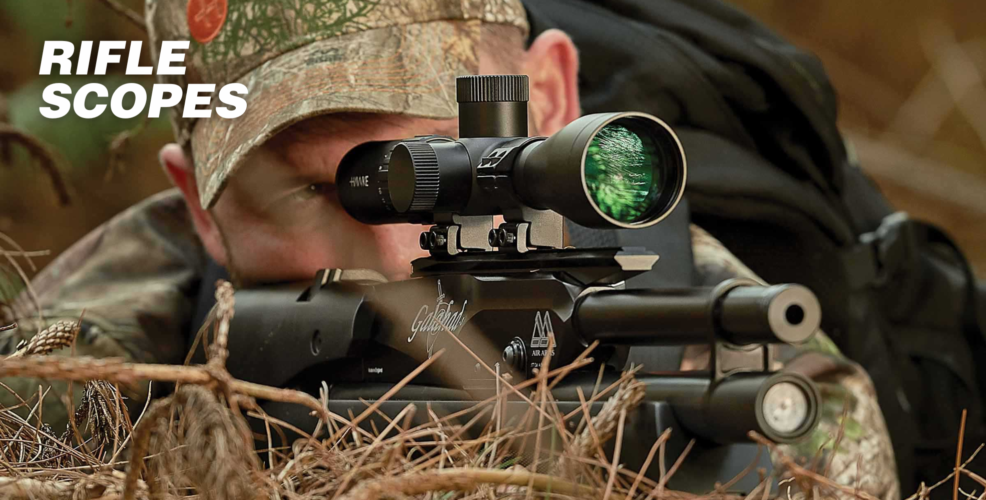 Person in camouflage aiming through a rifle scope in a wooded area, text "RIFLE SCOPES" on the image.