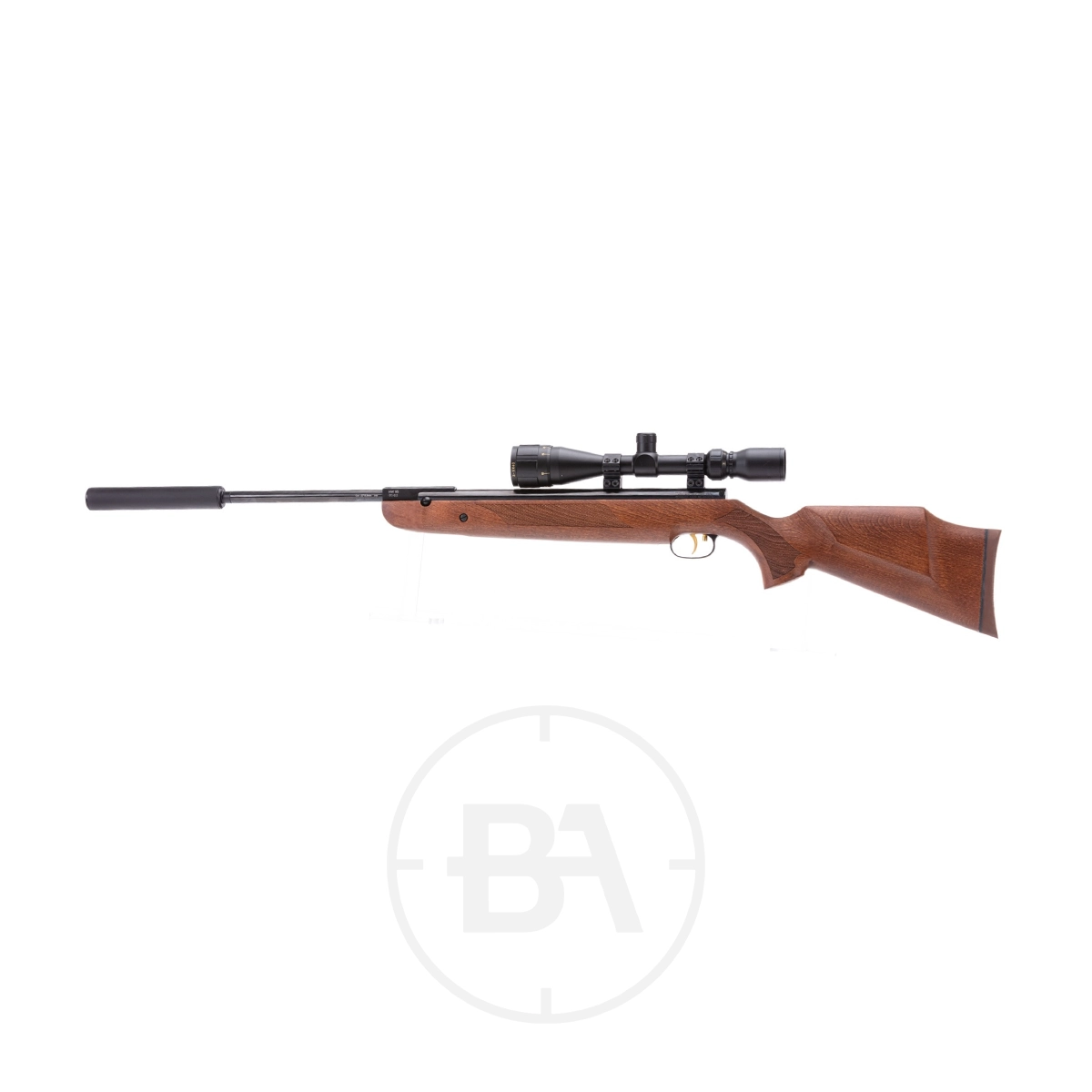 Weihrauch HW95 K Luxus Spring Air Rifle With Silencer 3 A Weihrauch HW95 K Luxus Spring Air Rifle with a wooden stock, mounted scope, and long barrel is shown in side profile against a white background.