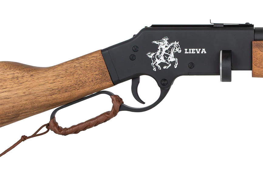 Close-up of a Reximex Lieva lever-action air rifle with a wooden stock. The black metal receiver features an illustration of a cowboy on a horse and "LIEVA" engraved beside it. A leather strap is wrapped round the lever.
