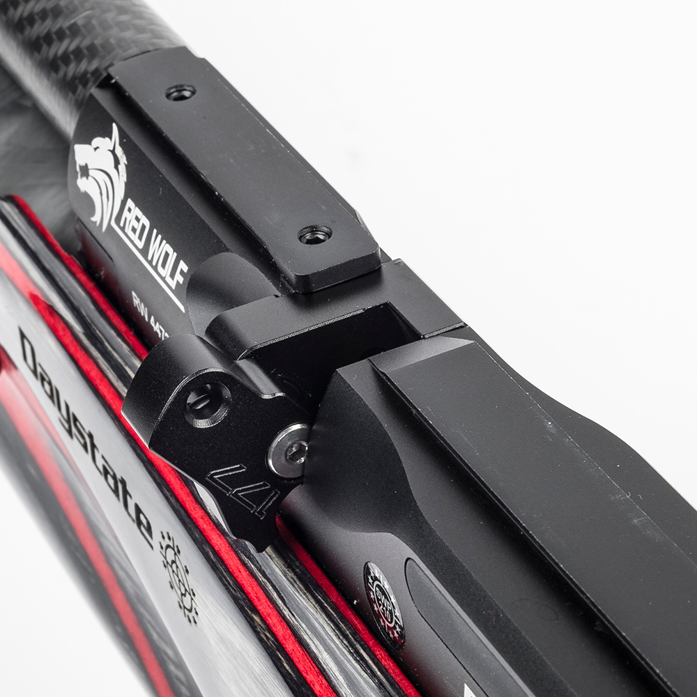 Daystate Red Wolf / Wolverine R Flip-Out Single Shot Loader 9 Close-up of a black and red Daystate Red Wolf with a Wolverine R Flip-Out Single Shot Loader, showcasing detailed branding and mechanical parts against a white background.