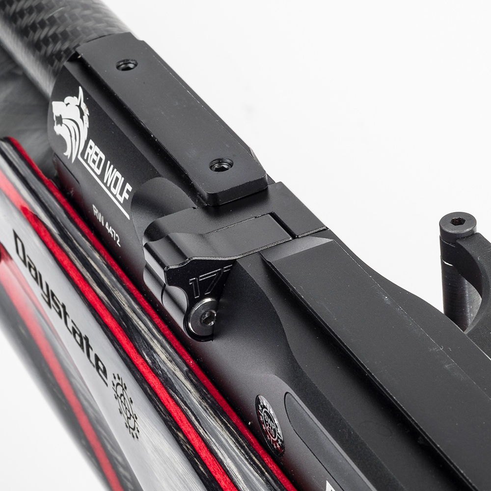 Daystate Red Wolf / Wolverine R Flip-Out Single Shot Loader 7 Close-up view of a black Daystate Red Wolf air rifle with the logo and model name, featuring the Wolverine R Flip-Out Single Shot Loader and carbon fibre barrel, shown against a white background.