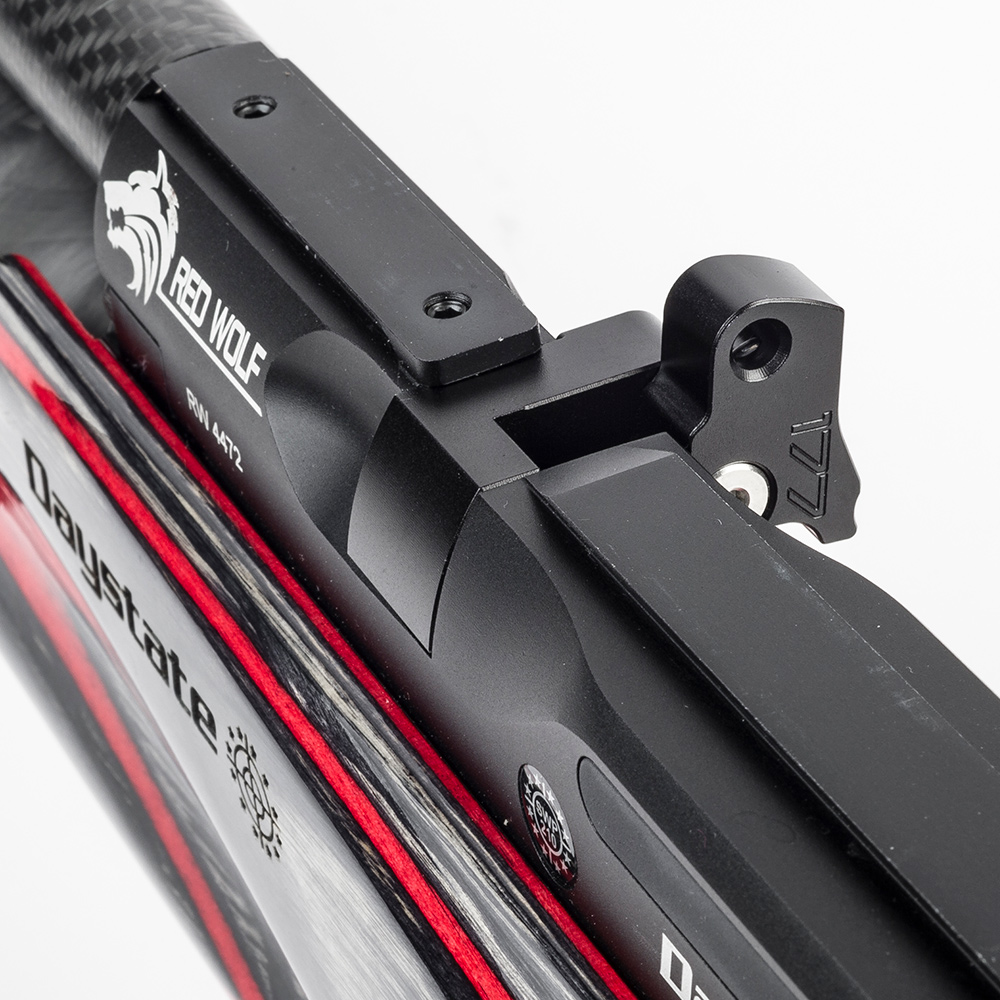 Daystate Red Wolf / Wolverine R Flip-Out Single Shot Loader 5 Close-up of a black and red Daystate Red Wolf / Wolverine R air rifle with "RED WOLF" and wolf logo, detailed metal parts, partial Daystate branding, and compatibility with the Flip-Out Single Shot Loader.